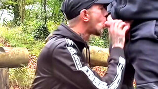 Scally twunk arched over a log in the rain Trackies down, taking it deep