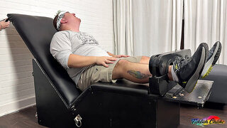 Vicky Vix straps Matt down and teases him hard in the tickling chair for wild gay action