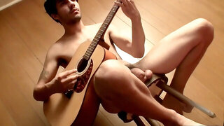 Straight musician gets ready to tug his big cock after playing a guitar solo