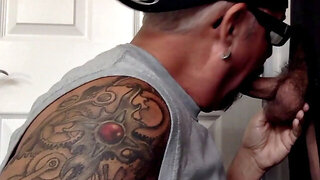Gloryhole tattooed DILF sucks BF's cock in private amateur BJ